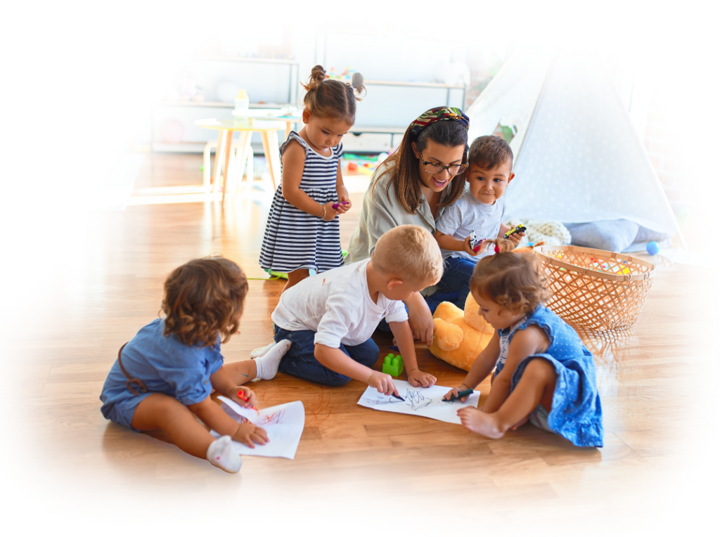 A childcare educator engaging with children in a creative learning activity at an early learning centre in Perth.