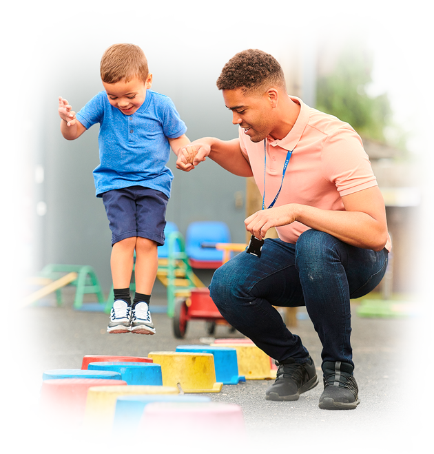 A childcare educator supporting a child’s development through active play at an early learning centre in Perth, fostering confidence in top childcare centres.