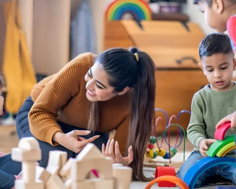 Public Holiday Changes in WA: A Parent’s Guide and How Stride Early Learning Is Helping Childcare educator playing with young children using blocks and toys.